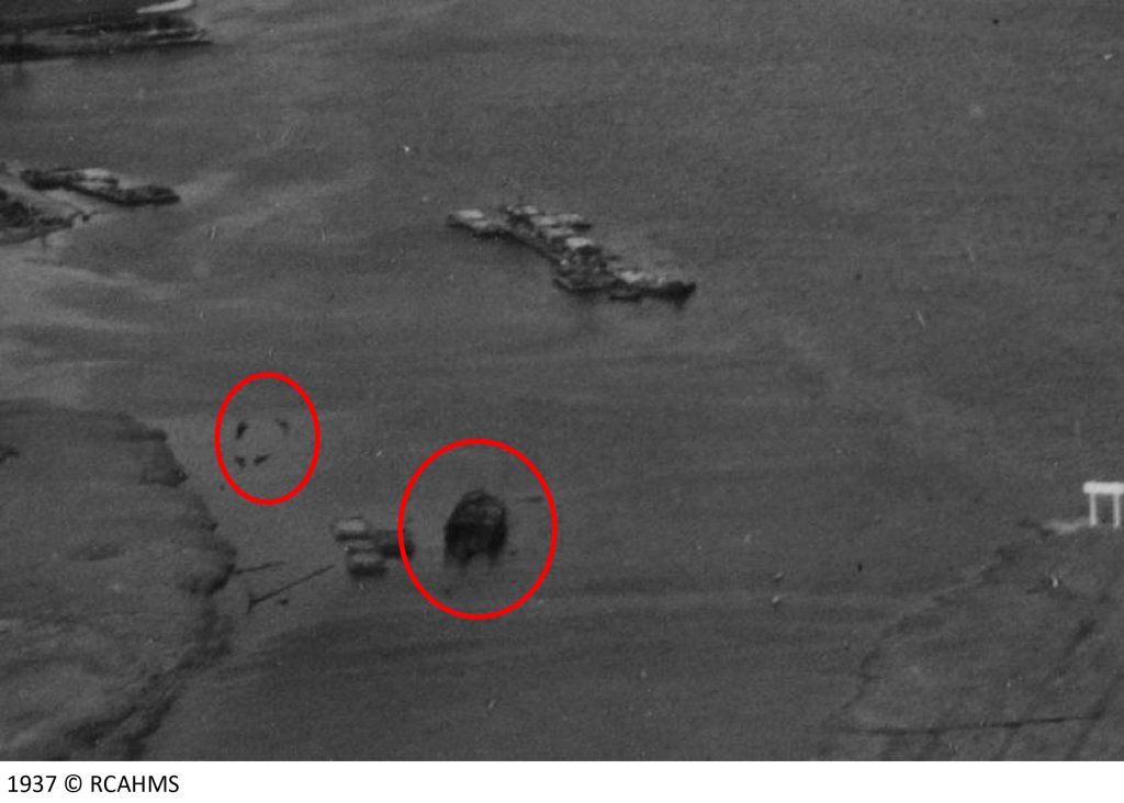 Aerial view from 1937, with two wrecks visible at high tide. 