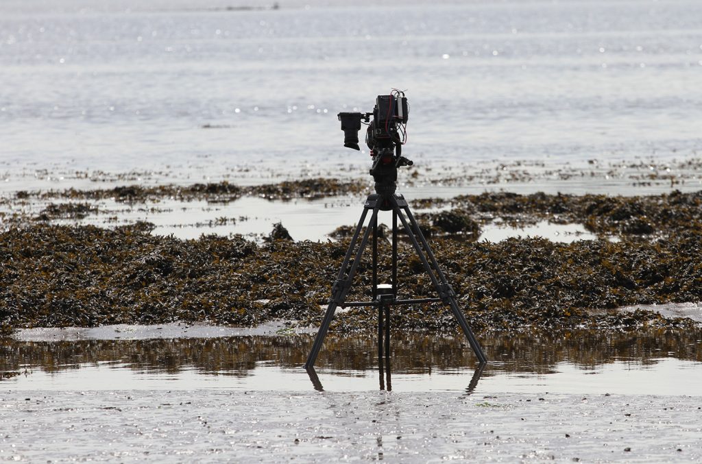 Camera filming the tide go out