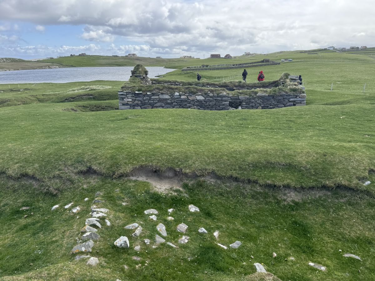 Tofts house and enclosure wall partly buried in sand