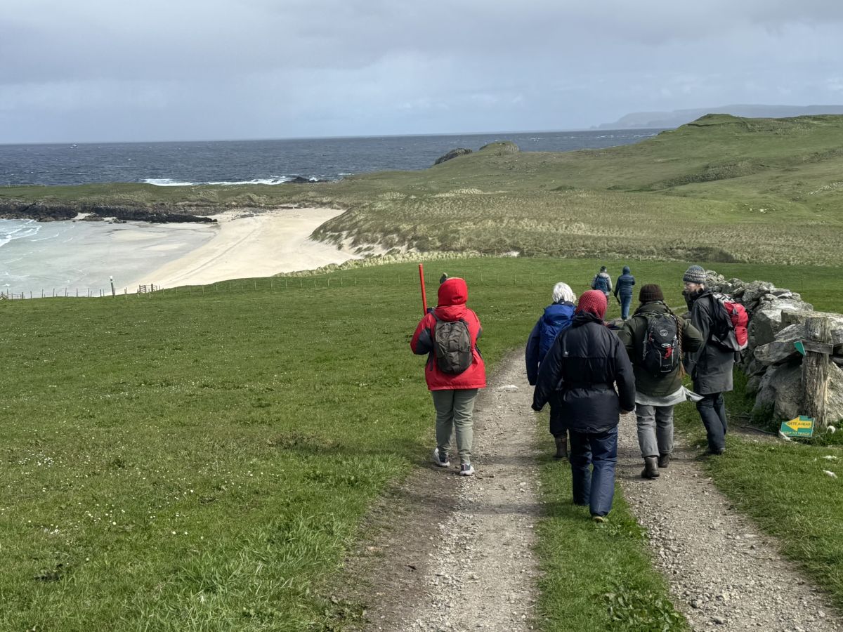 Survey team walking to Sands of Breckon