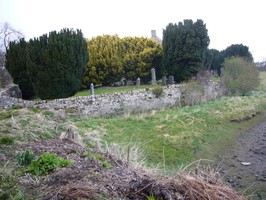 Churchyard retaining wall on the south showing sea incursion below the wall