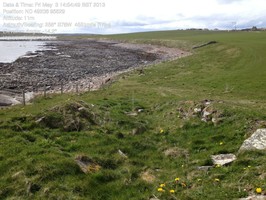 Looking WSW across cairn and down coast.  Low tide