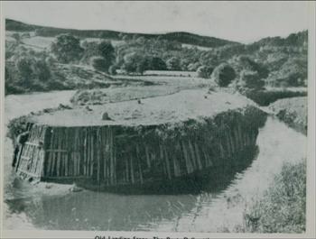19th century photo of the timber revetted quayside from Dalbeattie Museum website.