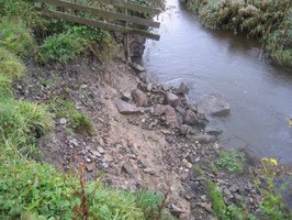 Detail of quay wall collapsing into channel