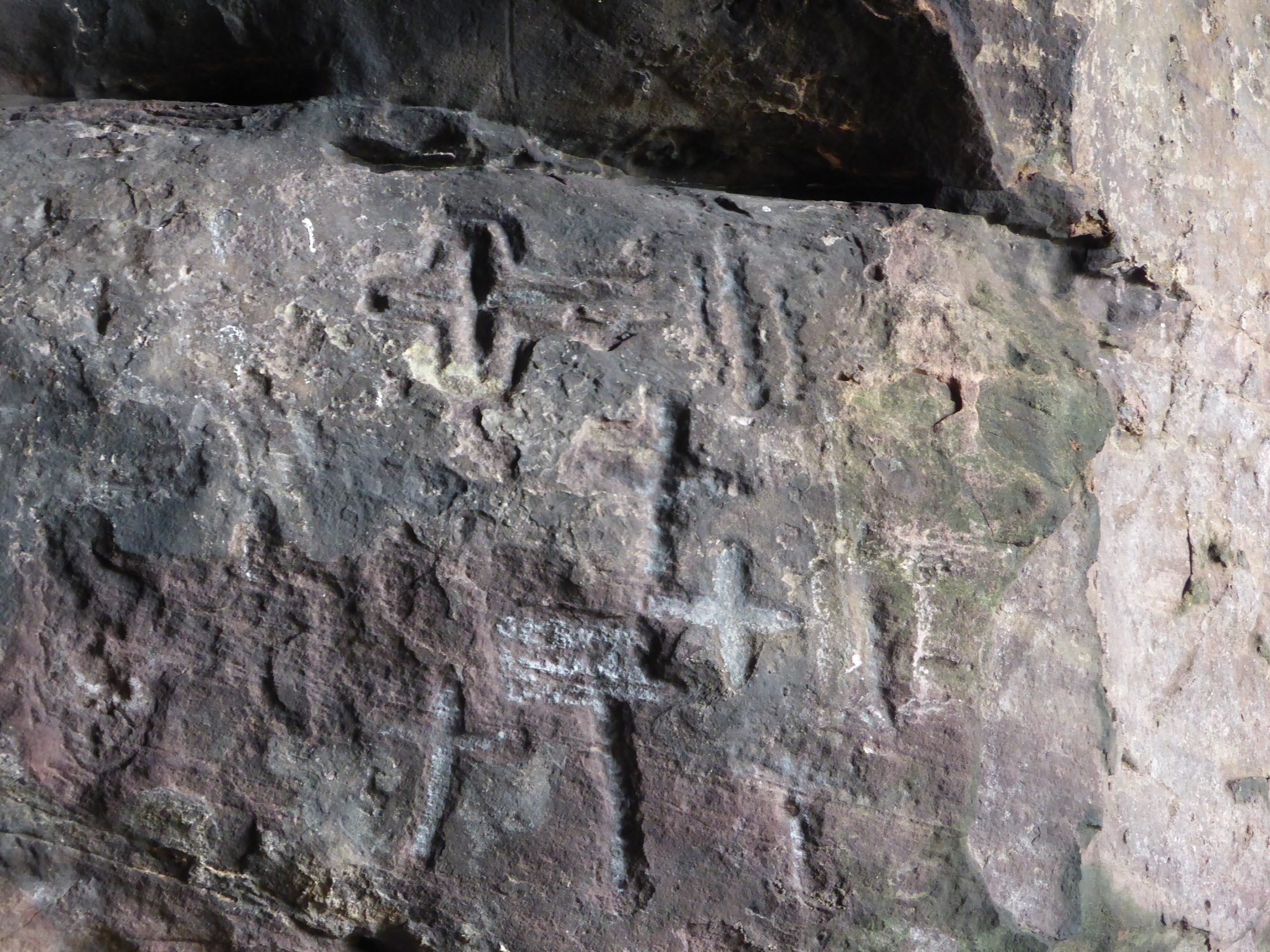 Detail of cross carvings, north wall towards front of cave