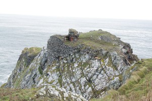 Fast Castle by Hugh Dinwoodie. Showing the masonry on the western cliff face.