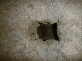 Detail of hole made in the muddy cave floor