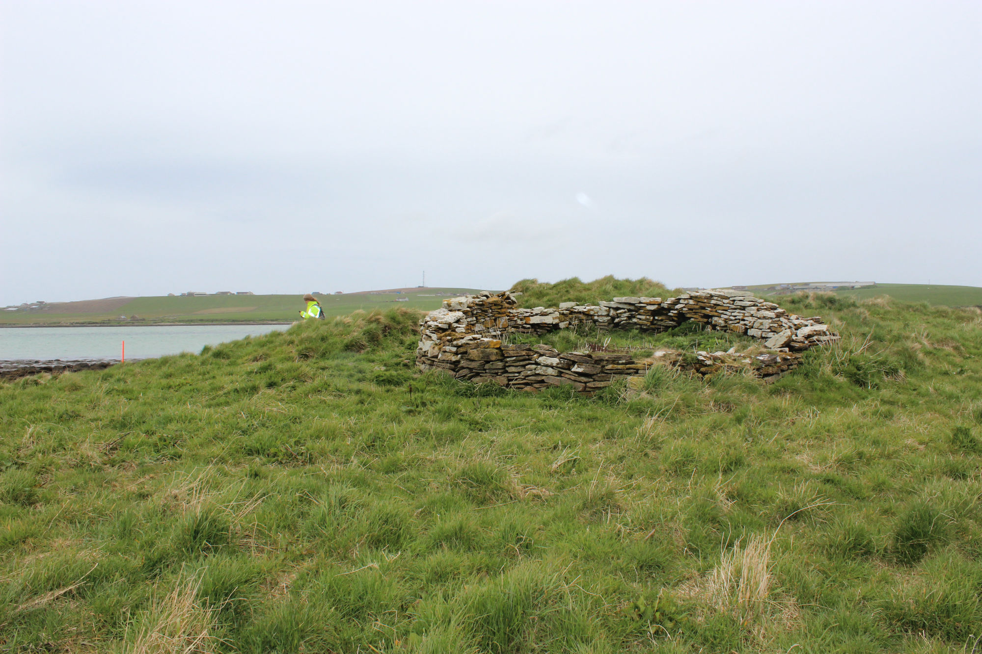 Cummi Howe showing the sheep pen built on top of the mound