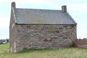 East wall of west pan house showing erosion of mortar