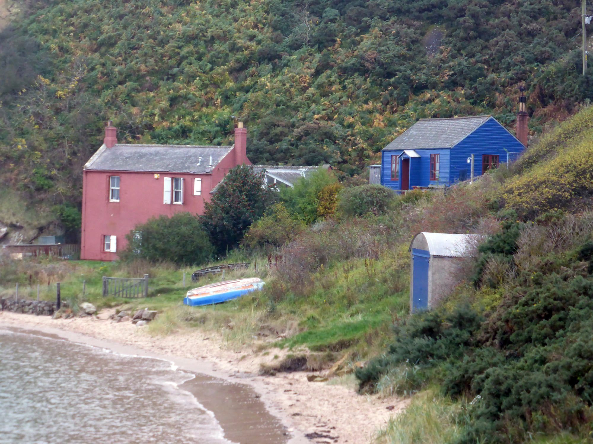 Occupied houses on east side of harbour, looking E