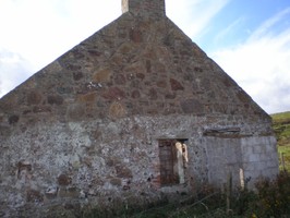 View of east gable end wall of Bothy. Extended height and width clearly visible. Looking W