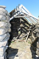 South hut showing partially collapsed roof