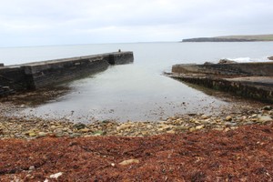 Interior of harbour, pier on left, breakwater on right