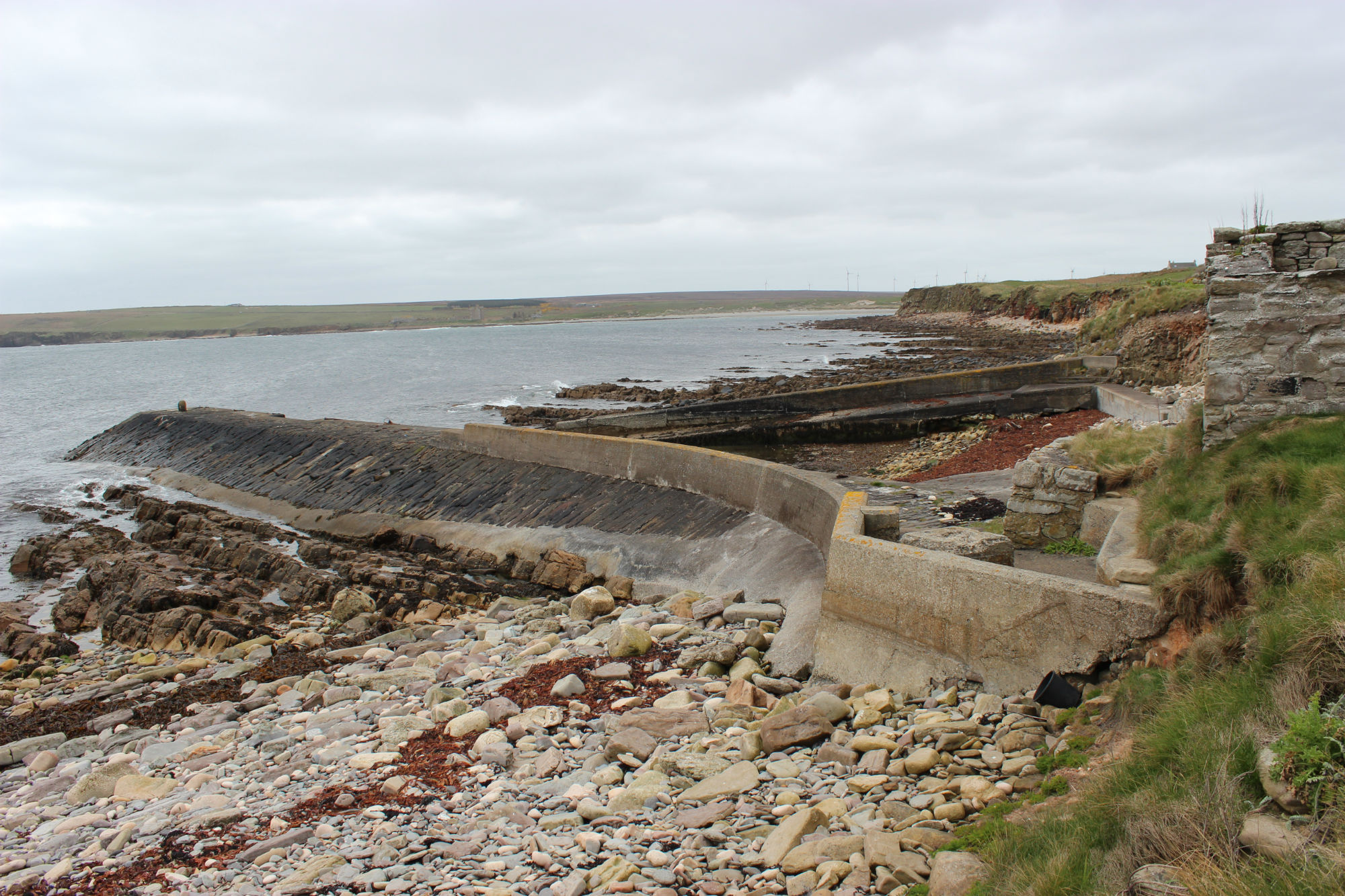 External (east) face of pier and gear store on coast edge
