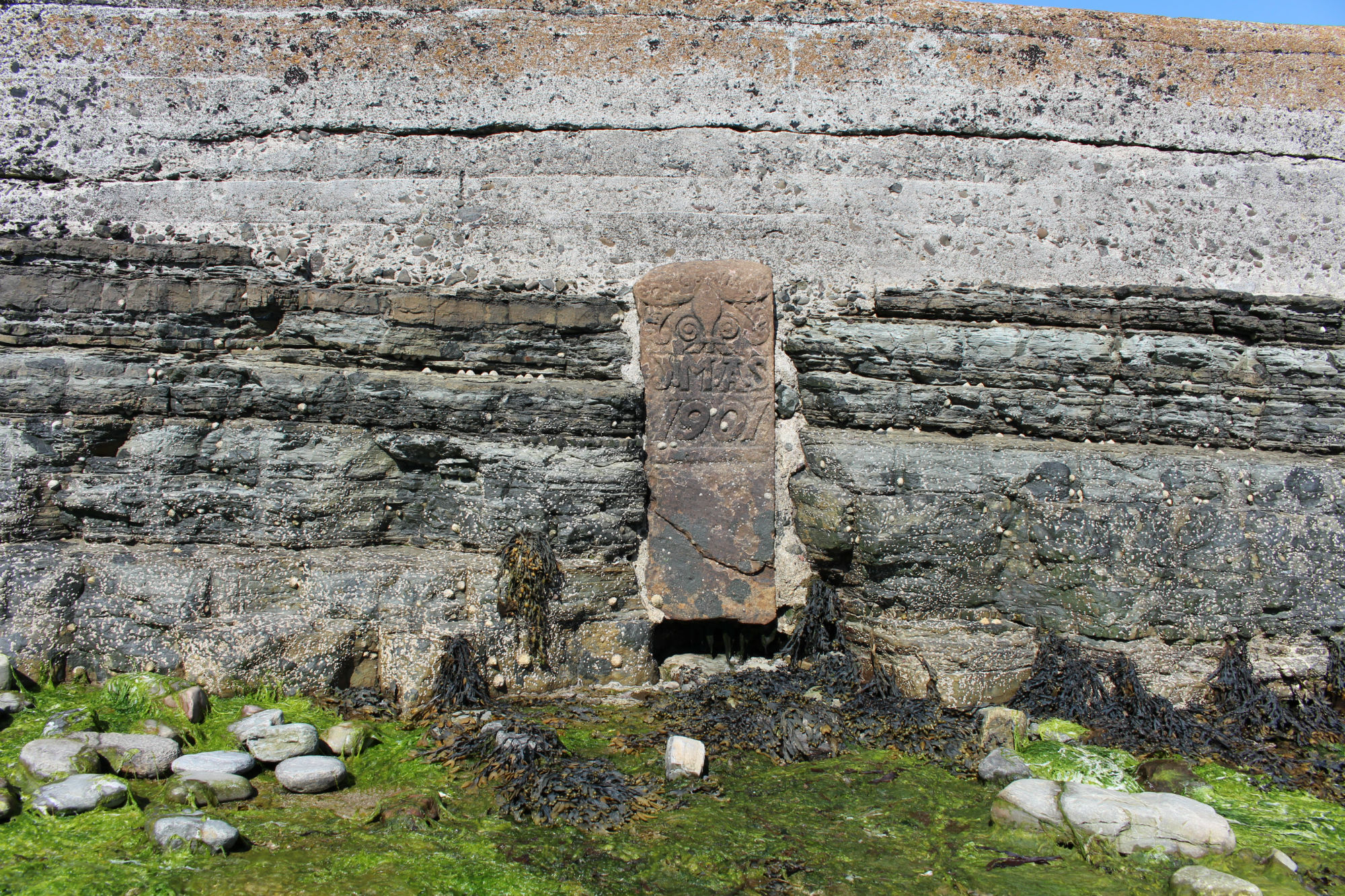 Carved stone set into south face of pier