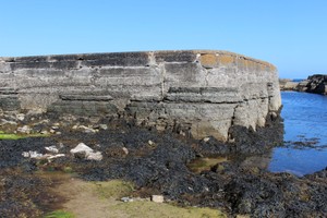 Face of pier showing concrete structure built onto bedrock