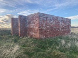 Northern most of two red brick walled structures. Looking north west.