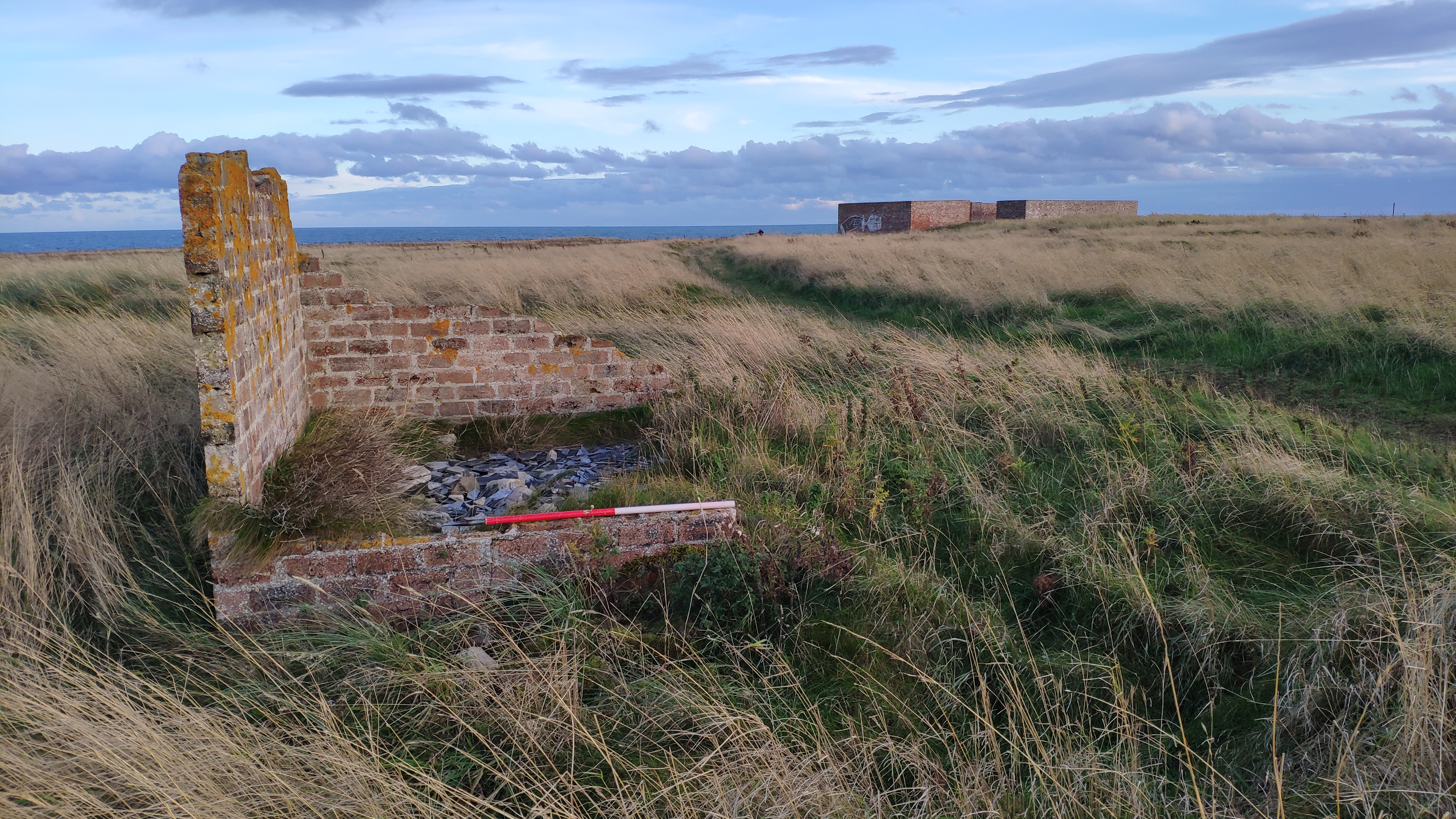Remains of red brick structure, looking east