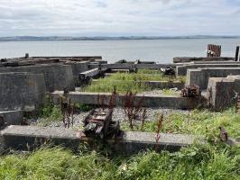 Timber and concrete slipway with remains of cast iron fixings, looking west. Location 1 on site map.