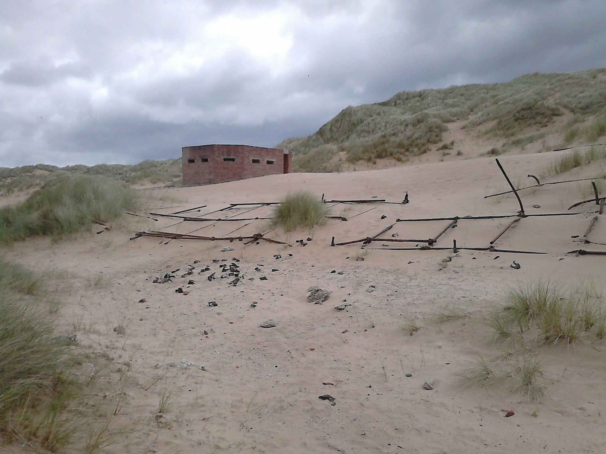 June 2018. Scaffolding poles and connectors with pillbox in background. Photo Richard Woods