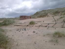 June 2018. Scaffolding poles and connectors with pillbox in background. Photo Richard Woods